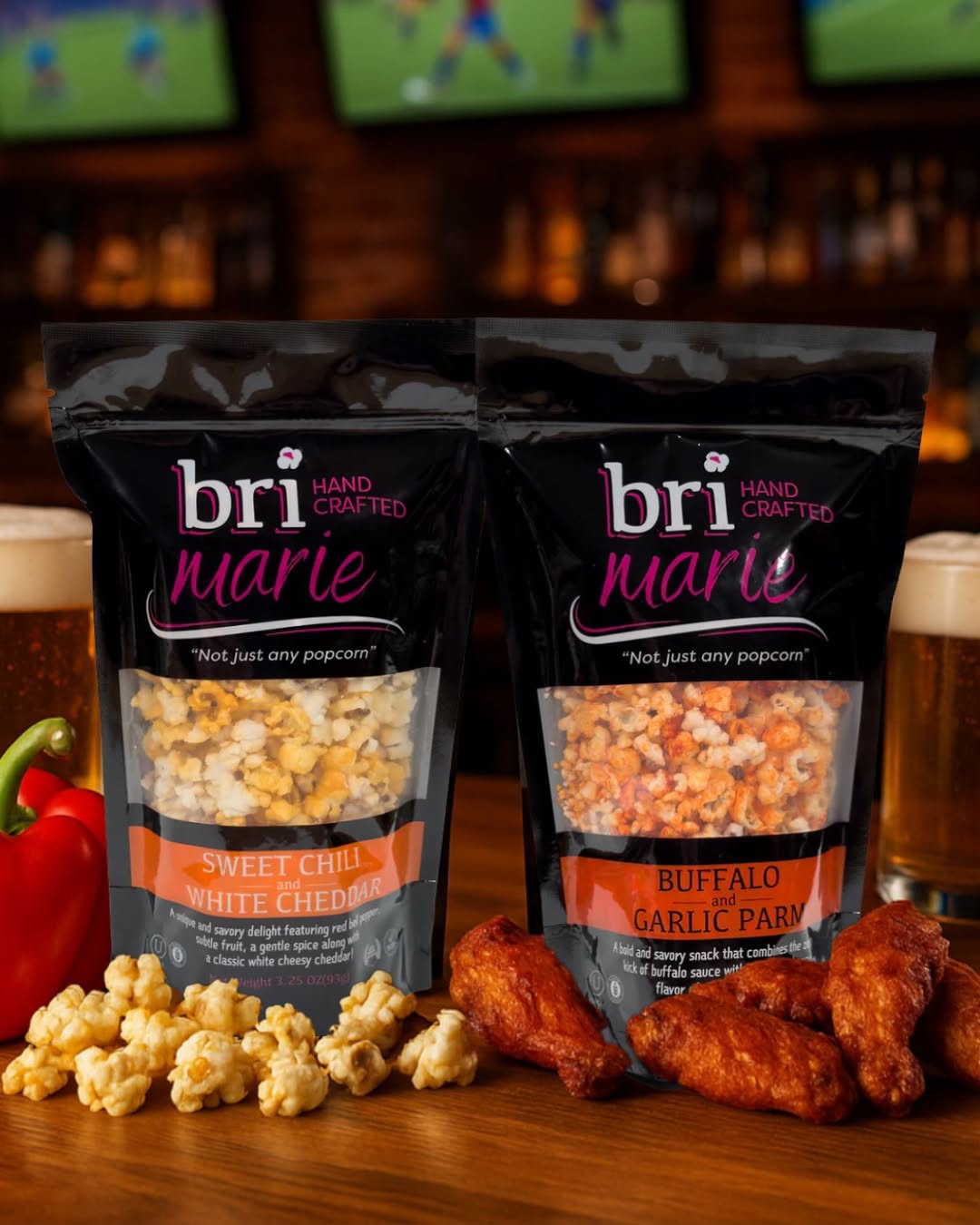 Bri Marie Sweet Chili White Cheddar and Buffalo Garlic Parm popcorn bags served with wings and beer.