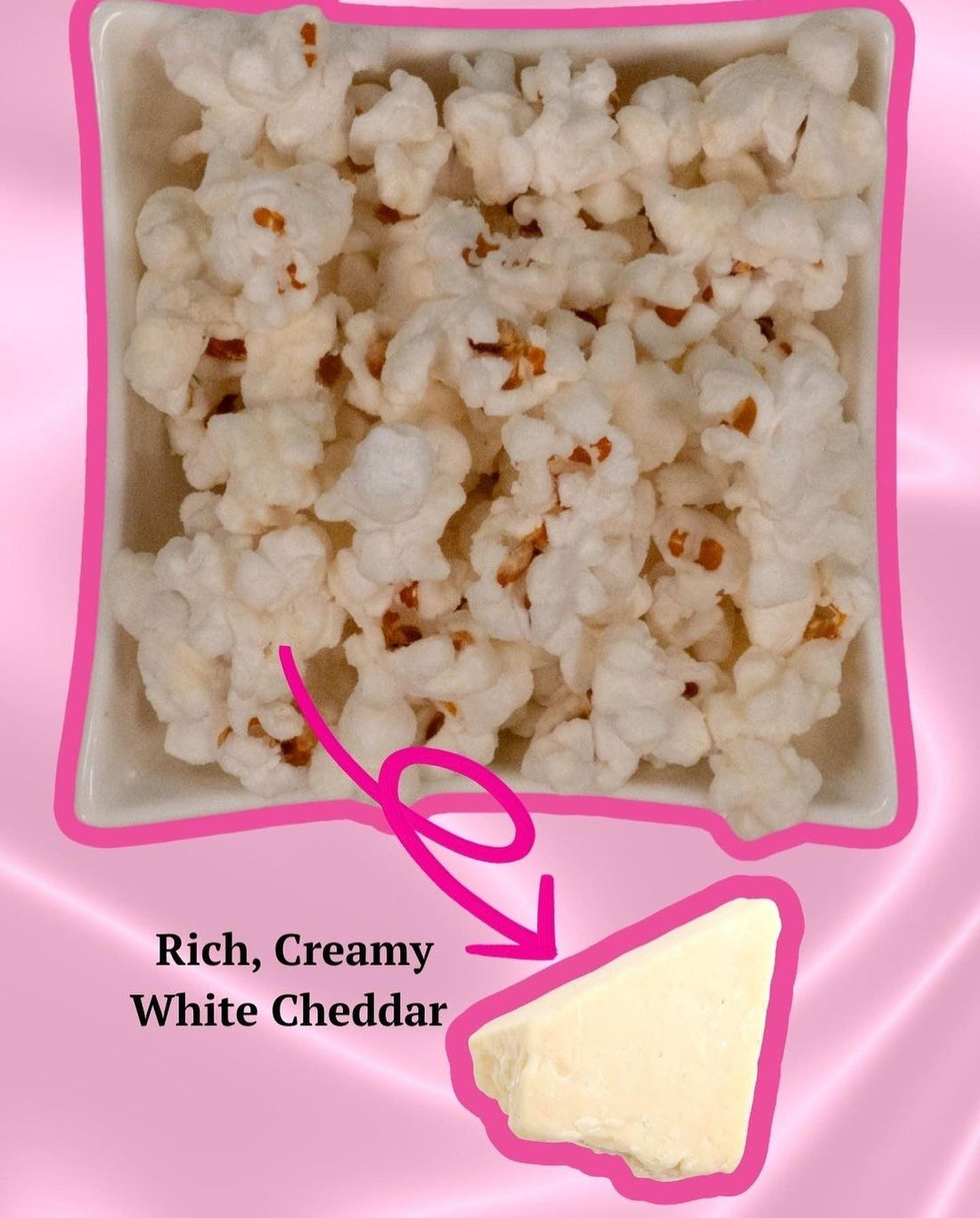 A white bowl of popcorn with a bright pink border and an arrow pointing to a wedge of Rich, Creamy White Cheddar.
