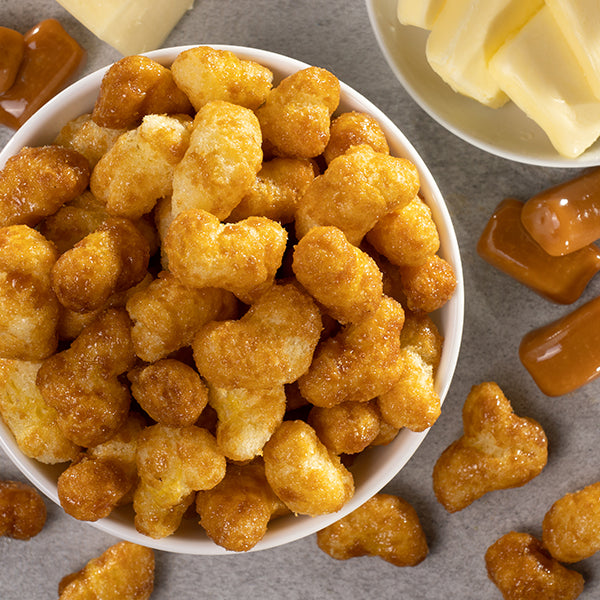 Airy caramel-drizzled corn puffs for a decadent snack.