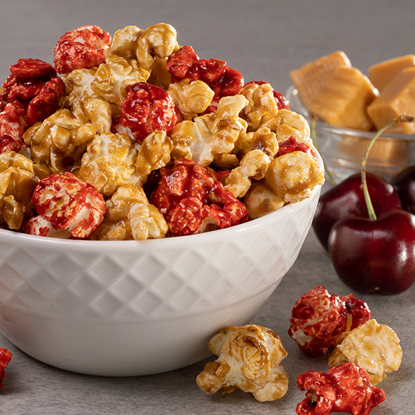 Red cherry and golden caramel swirled popcorn.